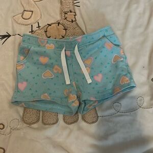 Blue shorts with hearts. 12 months